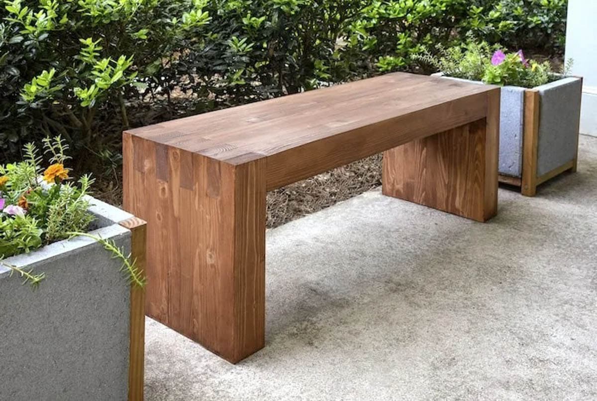 DIY outdoor bench made with 2x4s with waterfall ends