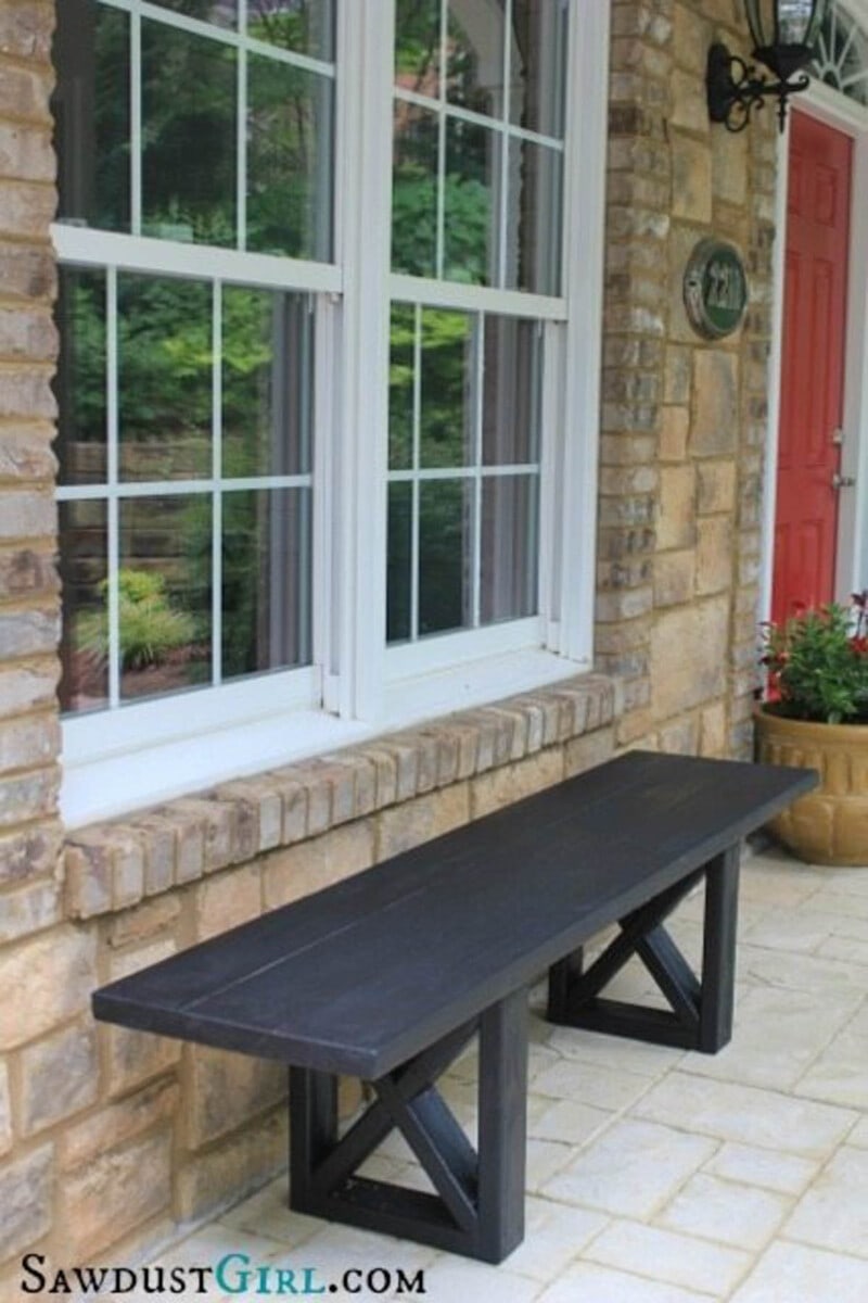 Black stained outdoor bench with x-leg detail