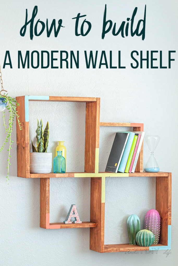 A DIY Modern Wall Shelf on the wall with decor and text overlay