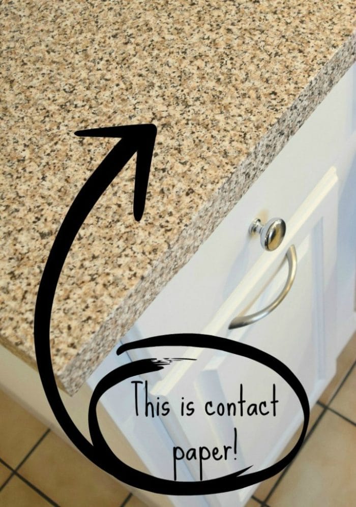 Kitchen countertop covered in granite contact paper