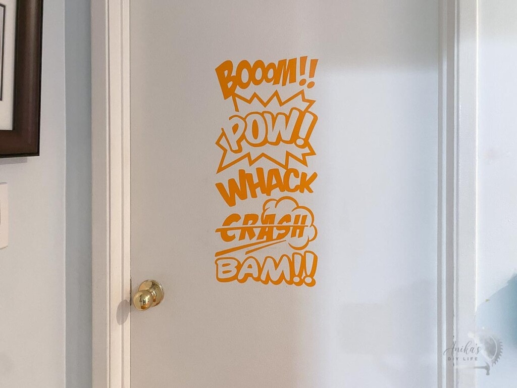 Door with orange comic book word art.