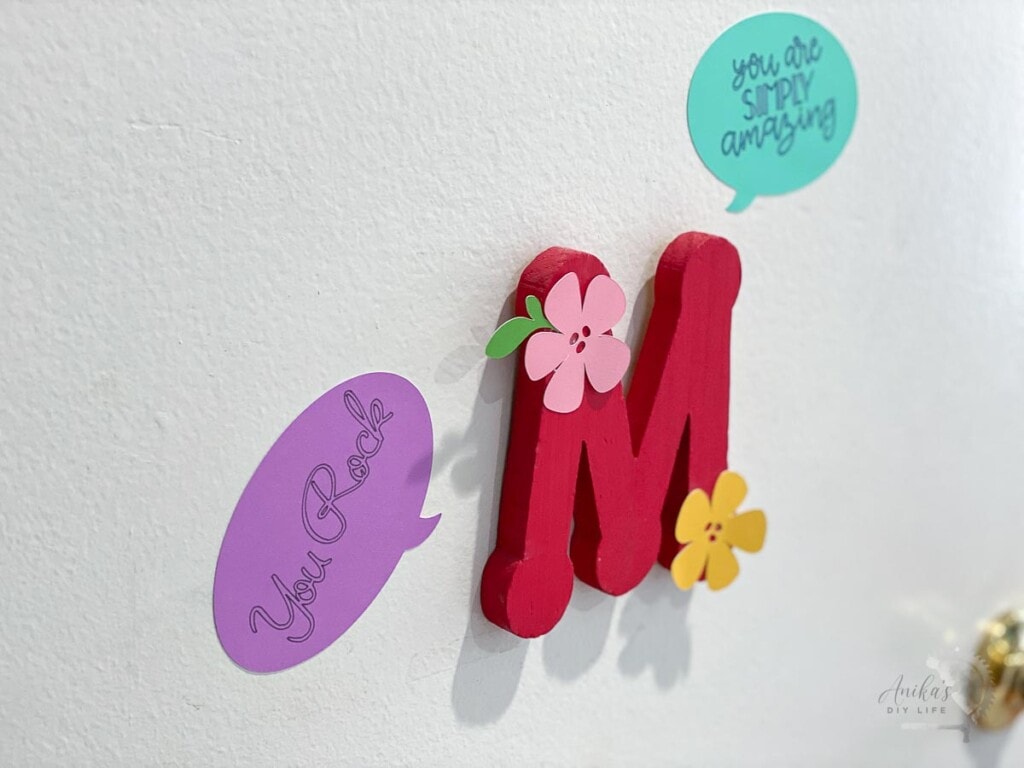 Door with wooden M decorated with paper stickers cut using Cricut Maer 3