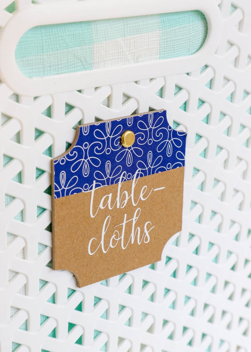 Tablecloth organizing tag on a basket