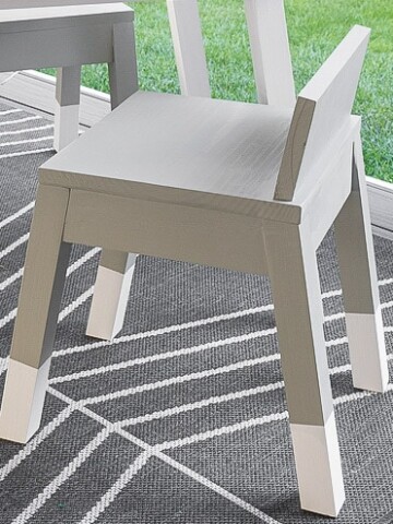 Learn how to build a simple modern angled leg DIY kids chair. The complete woodworking plans show you how to build this easy woodworking project for your toddler.