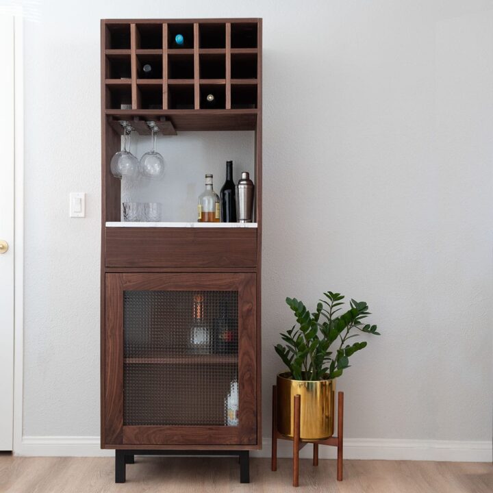 Learn how to build a DIY tall bar cabinet with drawer, wine rack, and wine glass holder with detailed plans. Perfect for small spaces.