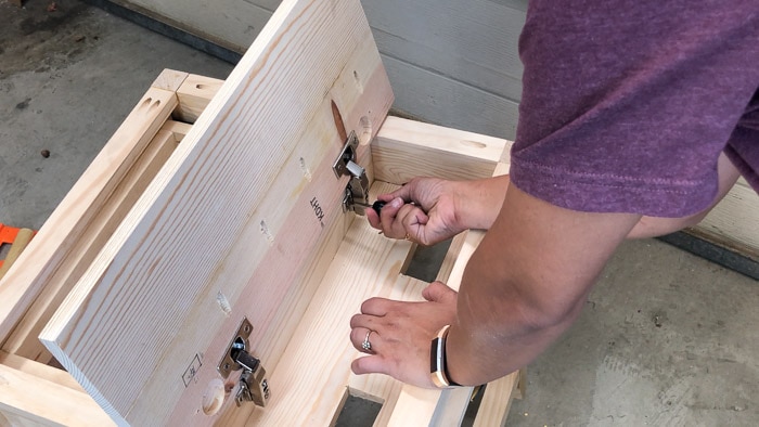 Attaching hinges to the DIY end table with charging station 