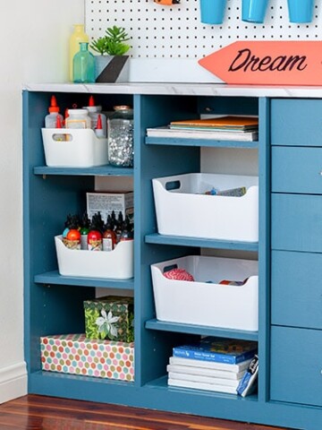 Learn how to build your own custom DIY craft closet organizer with drawers with these full plans, step by step tutorial and video. Turn any closet into the perfect organized craft closet.