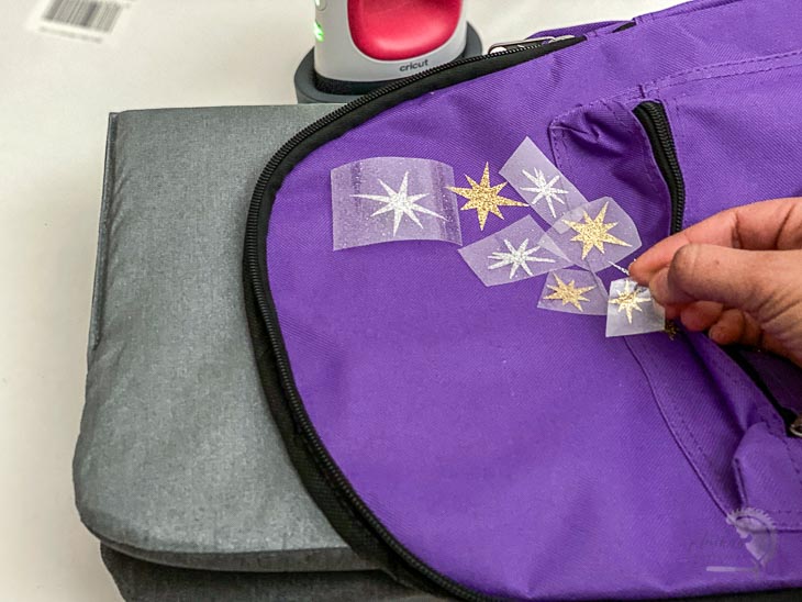 applying stars to the fairy backpack