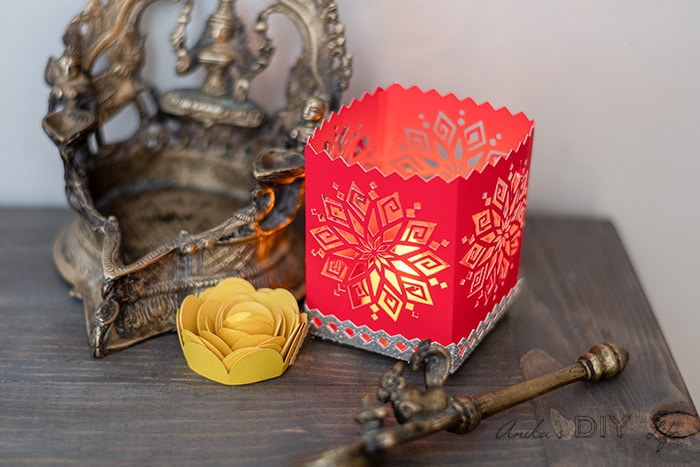 DIY Diwali luminary made on the Cricut on table with other traditional decor