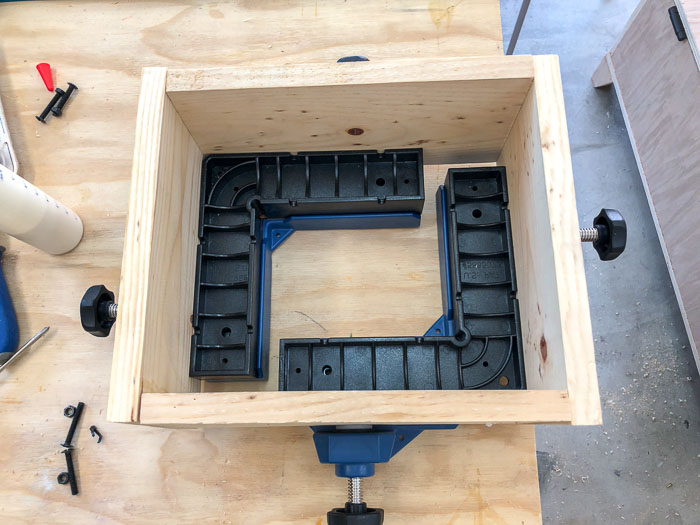 Making a drawer square using corner clamps. 
