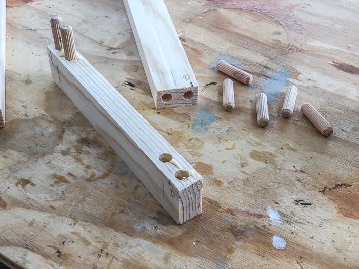 Dowel joinery on a workbench. 