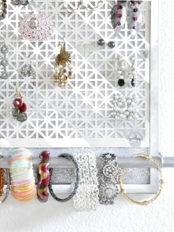 Make a DIY jewelry organizer to organize and display all your jewelry. This DIY wall jewelry organizer is easy to make with a few supplies. The perfect way to display bracelets, earrings, and necklaces with this hanging jewelry organizer.