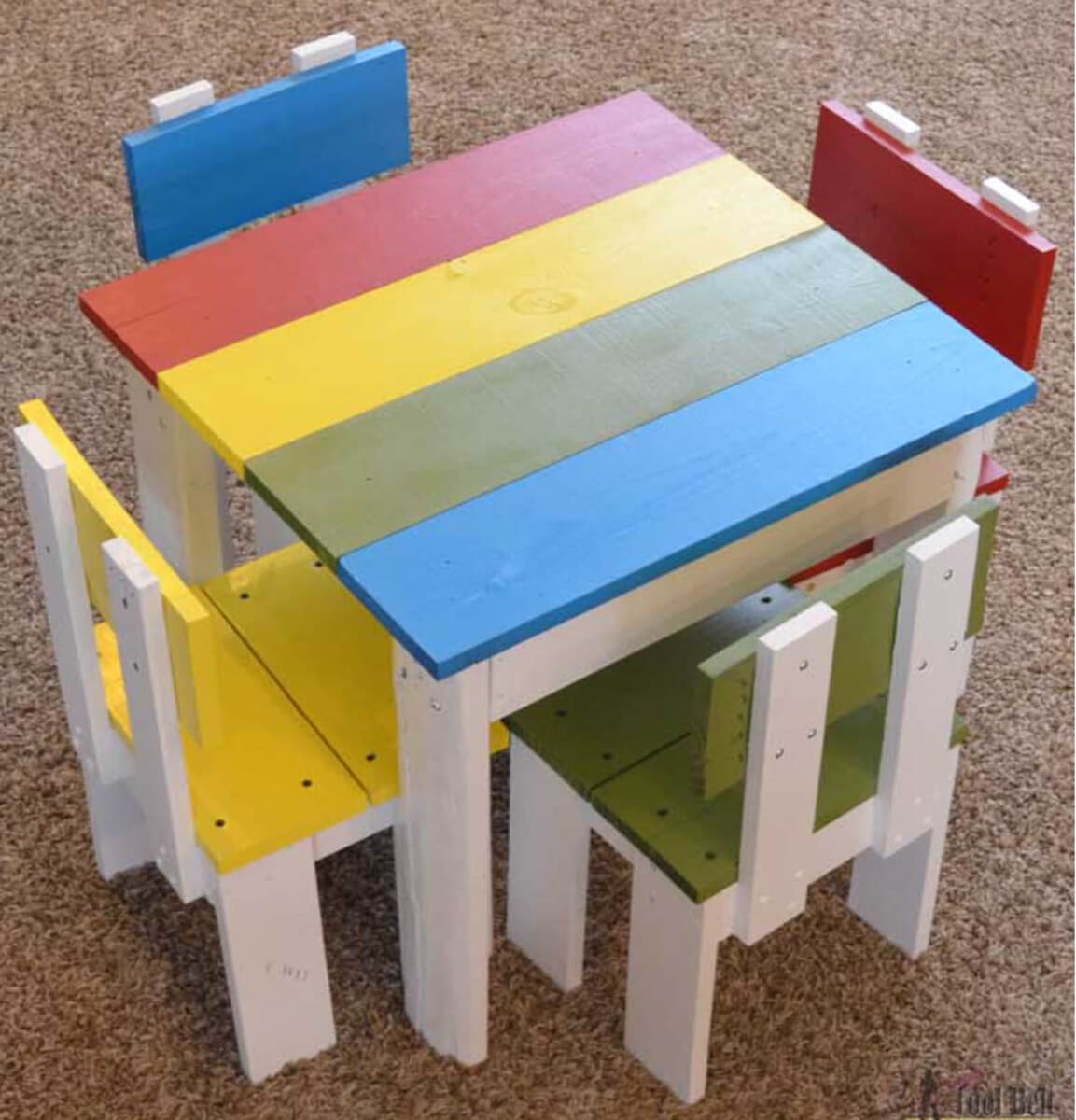 KIds table and four chairs with top and chair seats painted in primary colors
