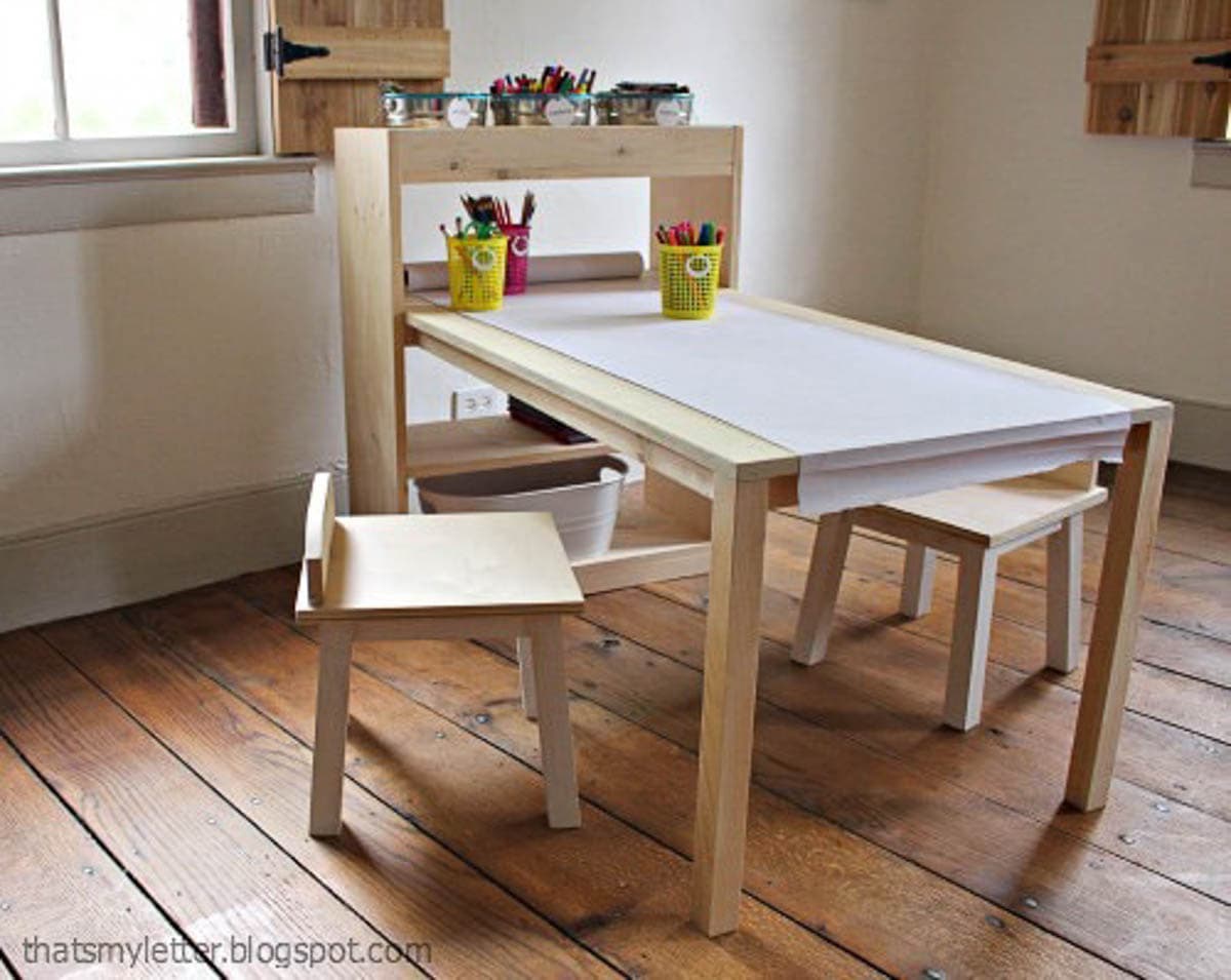 kids art table with stools and shelving for storage