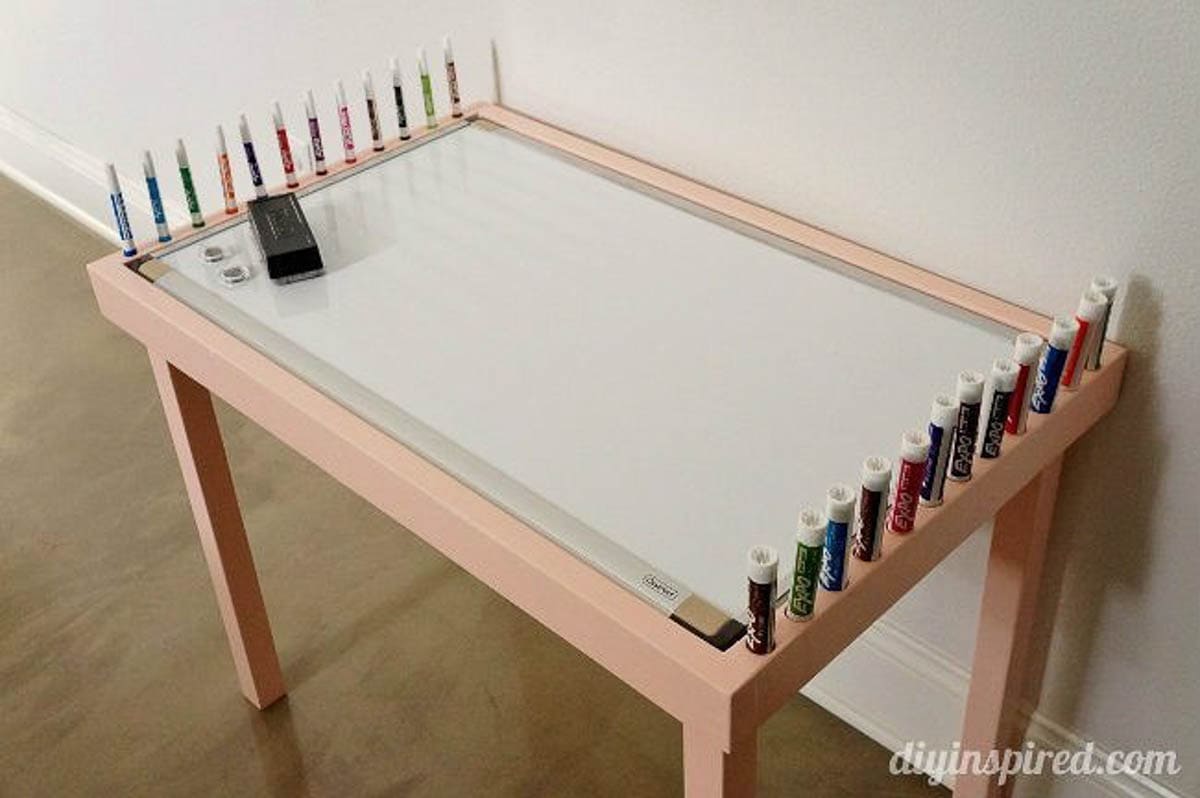 DIY kids table with a whiteboard on the table top with storage for markers