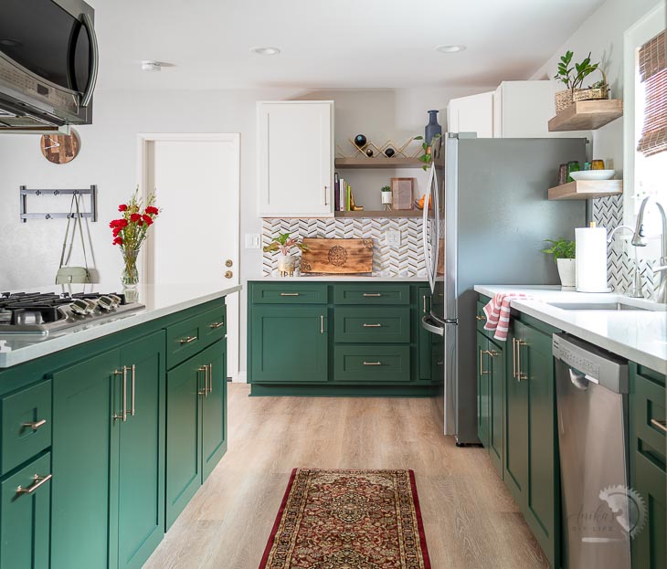 Kitchen makeover with green and white dual tone cabinets and open shelves