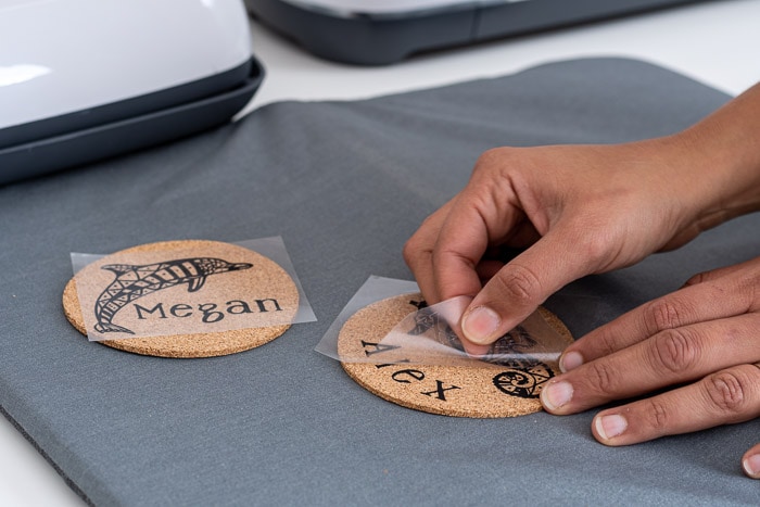 Peeling off backing to reveal design on cork coasters