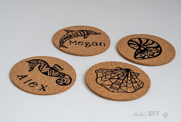 DIY personalized cork coasters on white table
