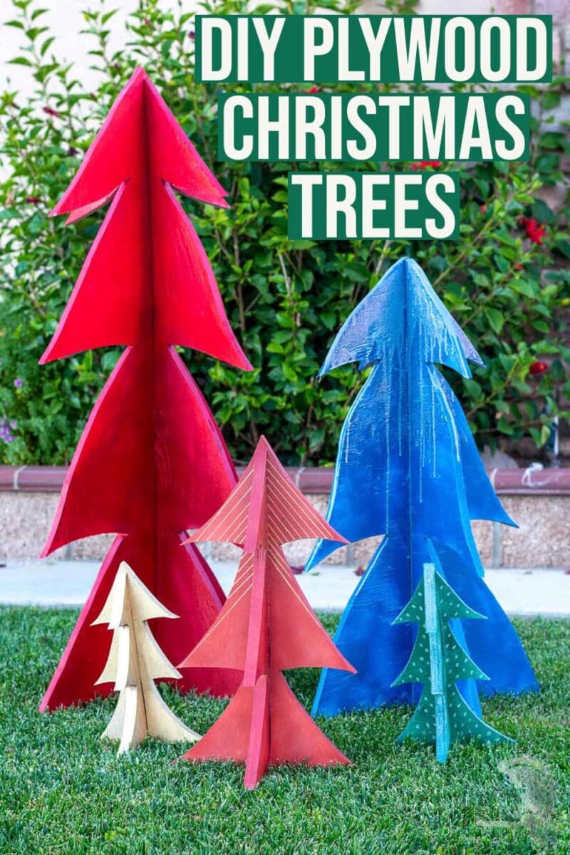 DIY wooden Christmas trees in yard with text overlay