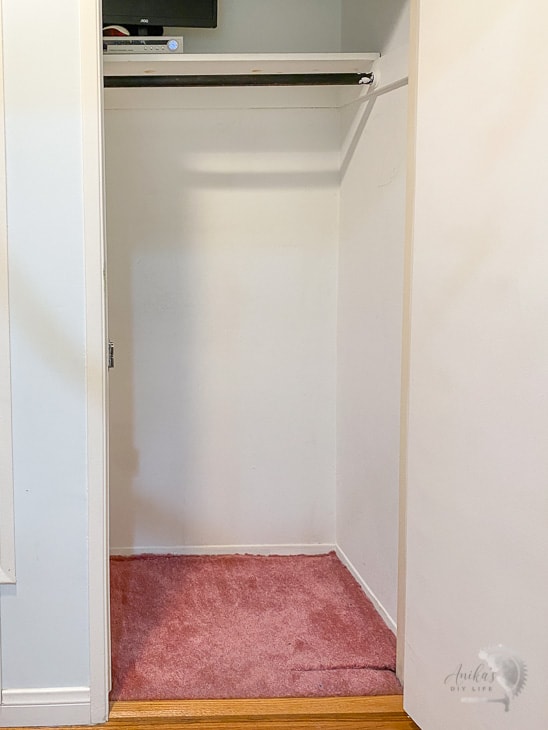 before of coat closet with pink carpet and white walls