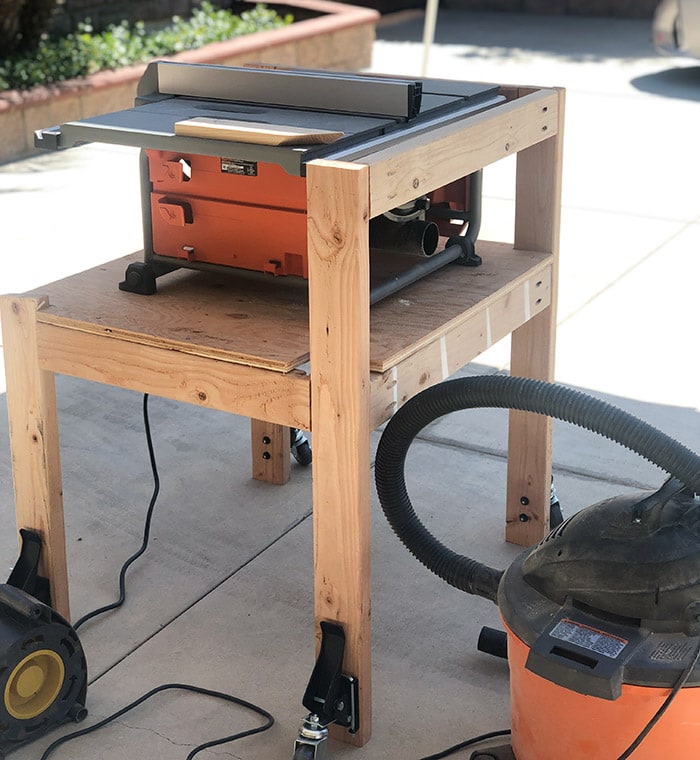 Table saw stand before the folding outfeed table