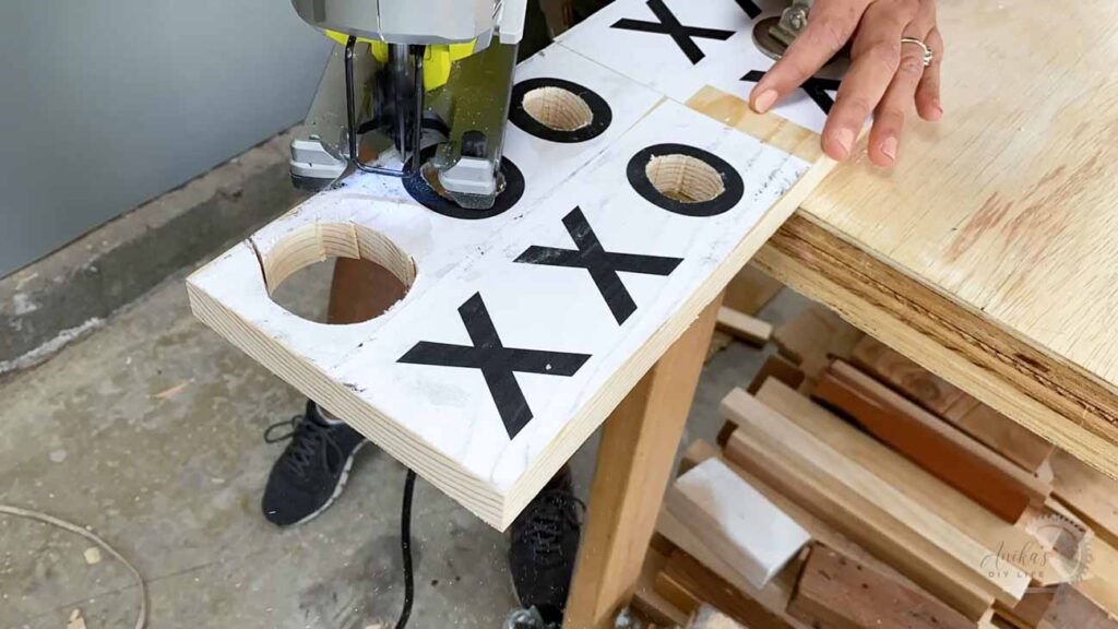 Cutting the X and O for the DIY wooden Tic Tac Toe game using a jigsaw