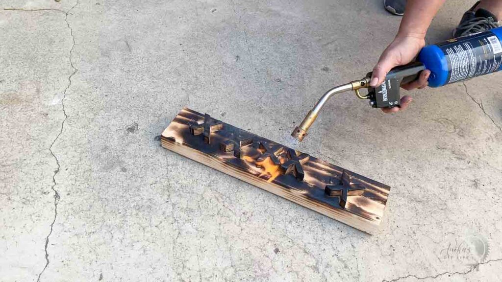 Torching the X and O using a propane blow torch