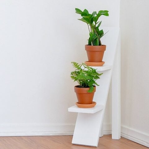 Build an easy DIY tiered plant stand with this step by step tutorial. The best part - uses scrap wood! Can be used indoors or outdoors!