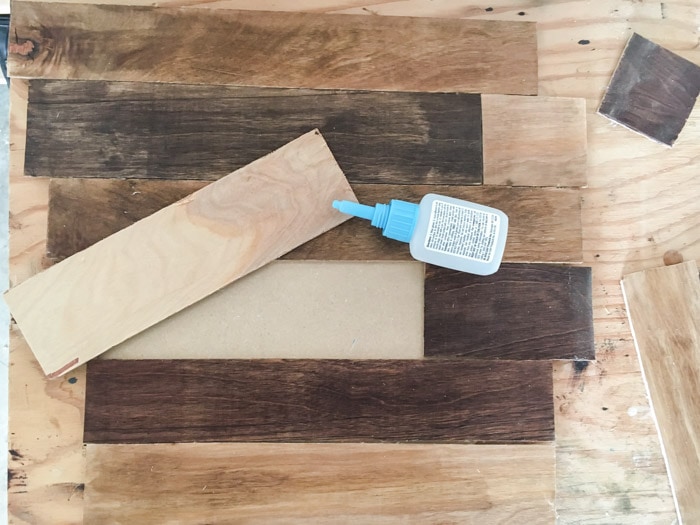 attaching strips to make the DIY wood clock