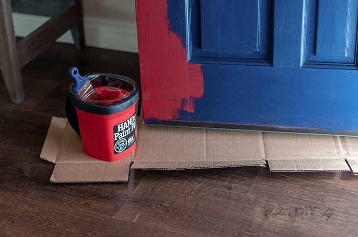 Front door makeover - picking the paint color by testing red. 