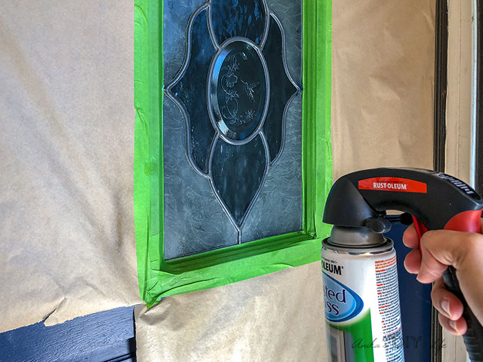 Spray Painting the glass insert with frost spray paint