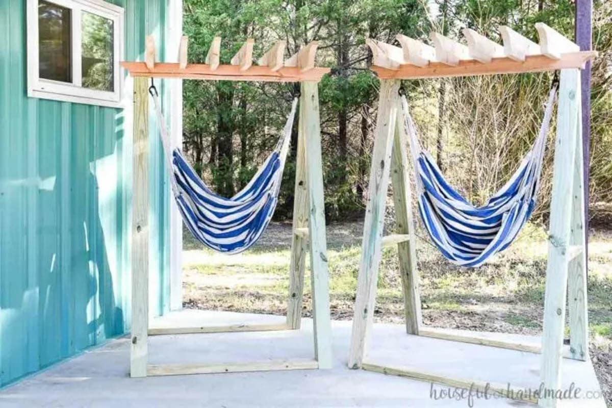 two hammock chair stands with blue and white striped hammock chairs
