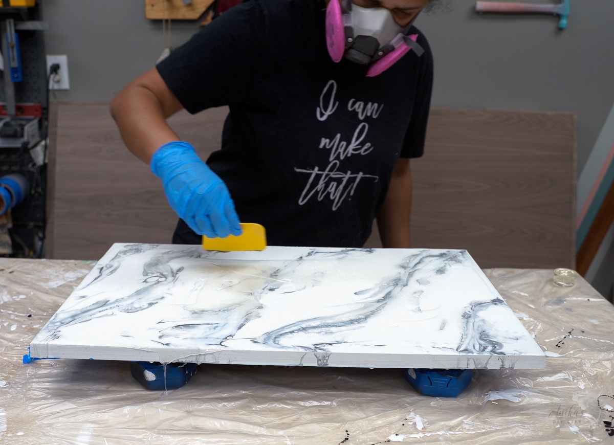 Woman making marble effect with epoxy