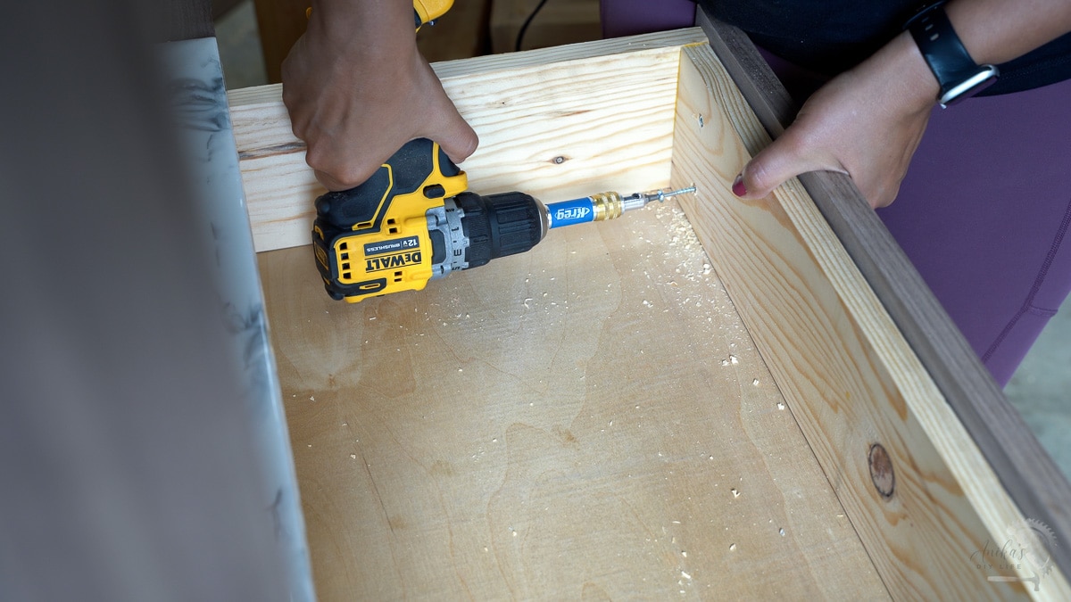 Adding countersunk screws to attach the drawer front