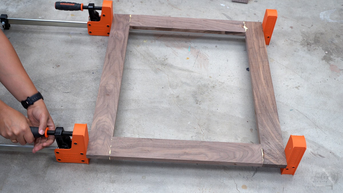 assembling door frame with a clamp