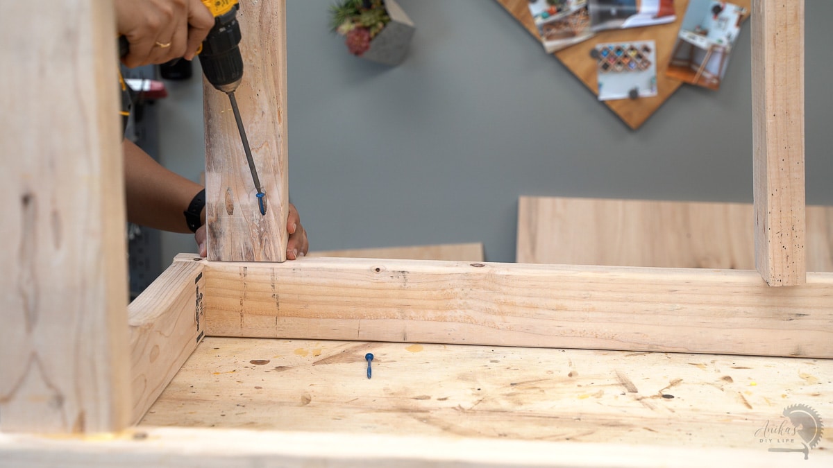 Attaching 2x4 boards to the 2x4 frame to build the planer stand