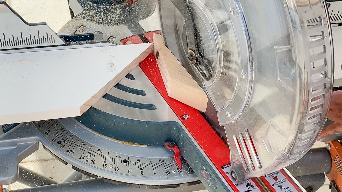 cutting out 60-degree angle with the miter saw set at 15-degree