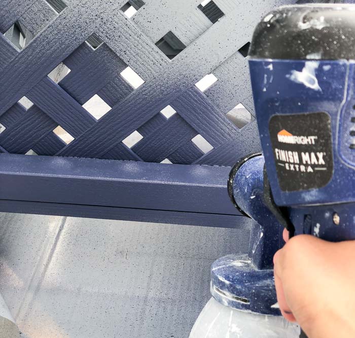Painting the DIY planter box navy with the HomeRight Finish Max paint sprayer