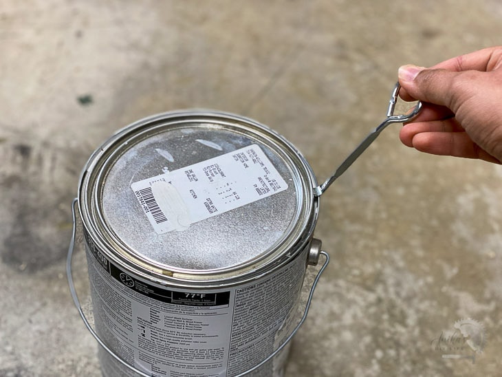 Opening a paint can with a paint can opener