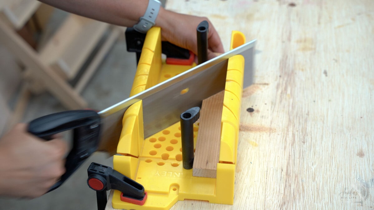 making a 45-degree miter cut using a miter box