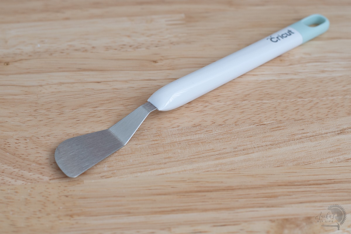 Cricut spatula on wood desk