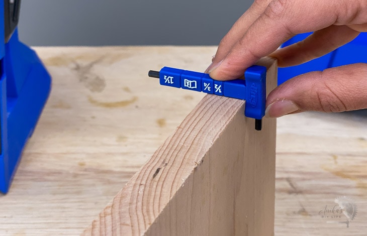 measuring the thickness of the 1x6 board with a thickness gauge