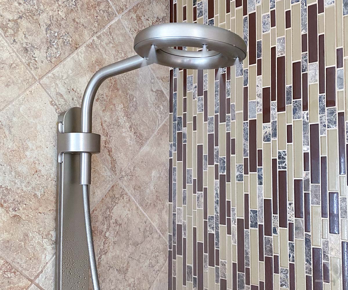 Nebia by Moen Shower in a bathroom with water flowing