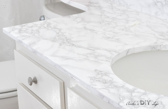 Bathroom countertops covered with marble contact paper