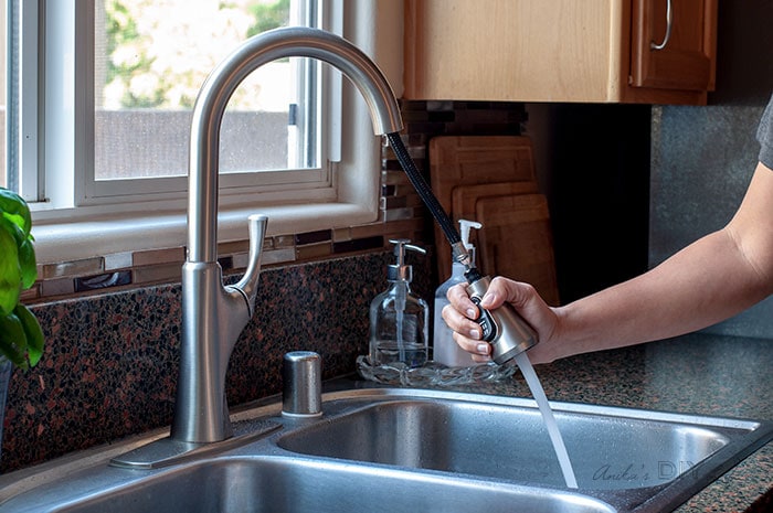 Pull down action of water sprayer in new kitchen faucet