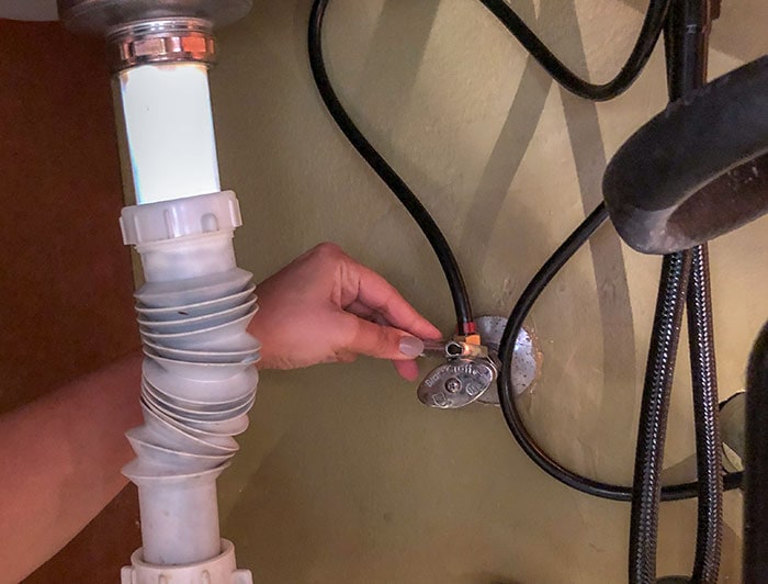 Connecting and tightening the water supply for the new kitchen faucet
