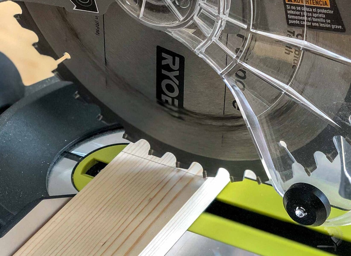 lining up the saw blade with the cut line on a board